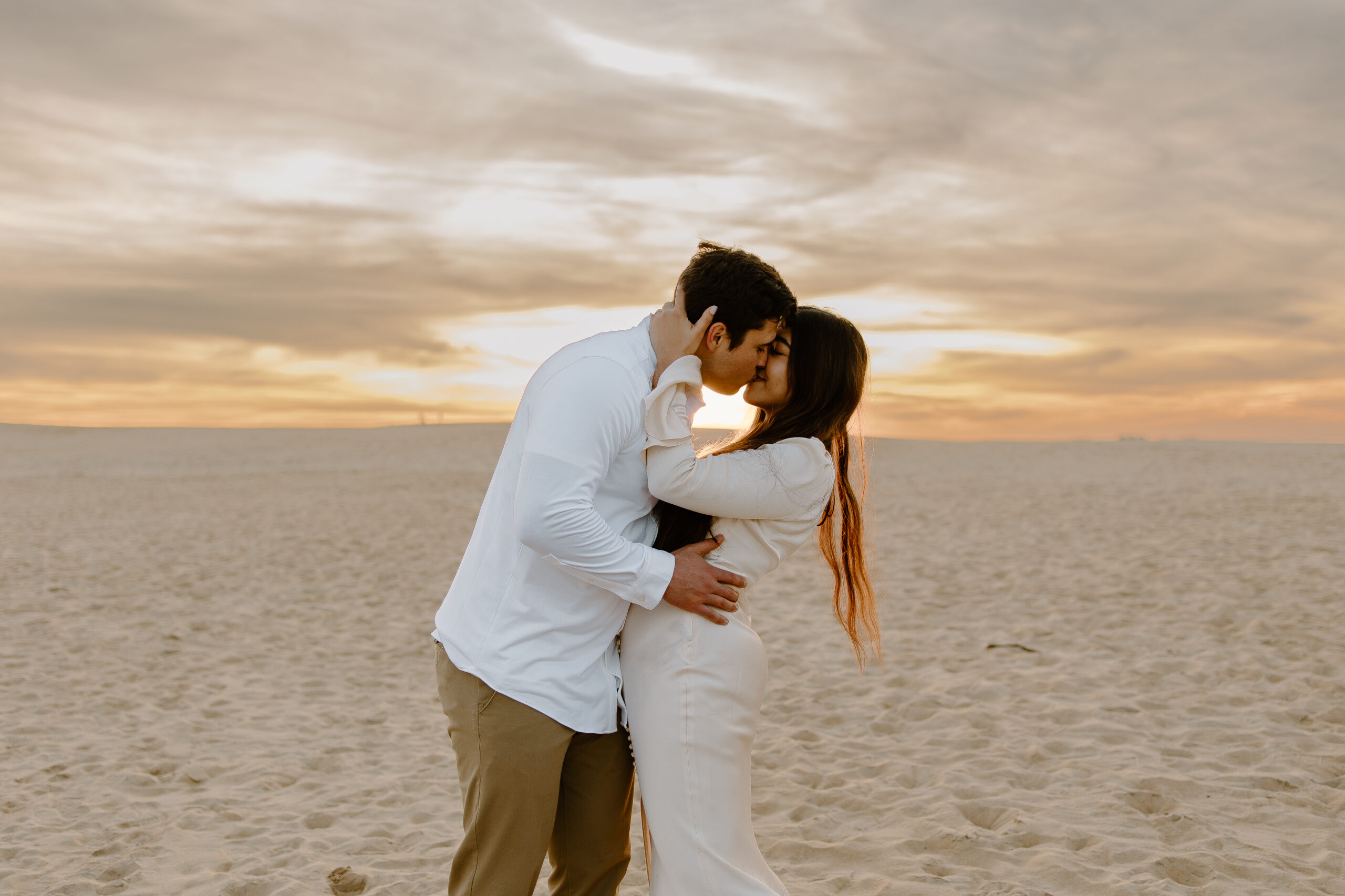 Sand dunes engagement pictures at Jockey's Ridge State Park, capturing the beauty of the tallest sand dunes on the East Coast