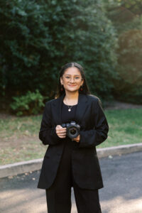 Raleigh wedding photographer holding camera