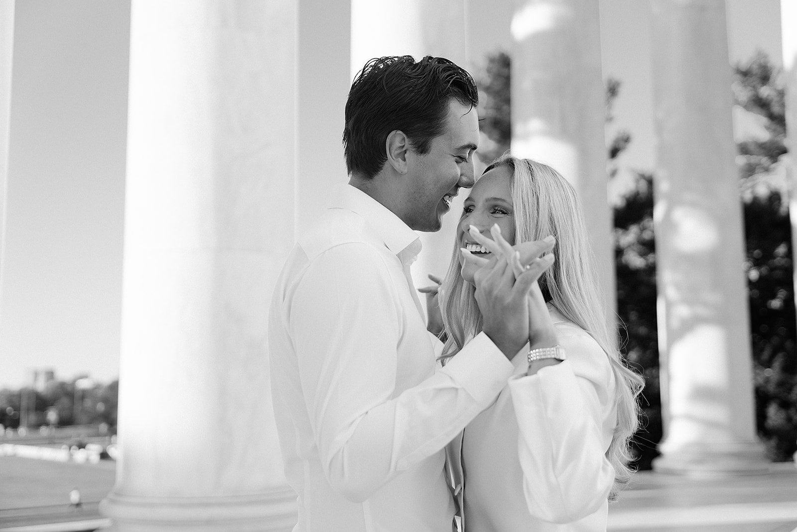 Couple walking between the columns during a Thomas Jefferson Memorial engagement session in Washington DC, photographed by a DC wedding photographer